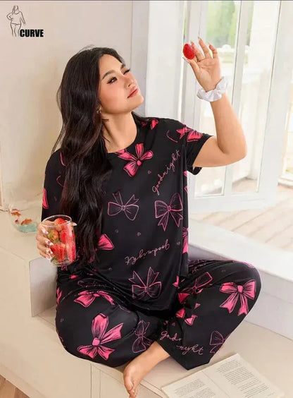 Black and pink girls and women's night suit made of premium fabric by Comfettie, featuring comfortable, soft material.