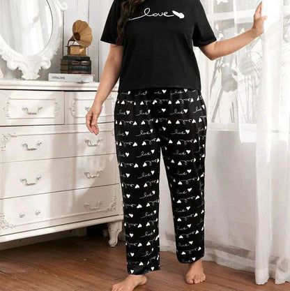 Black heart and love printed cotton night suit from Comfettie, featuring a comfortable Jarsy fabric design.