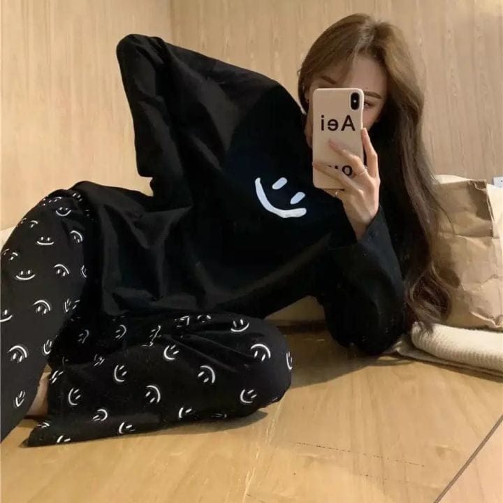 Black smile print full sleeves cotton night suit by Comfettie, featuring a comfortable design with colorful printed patterns.