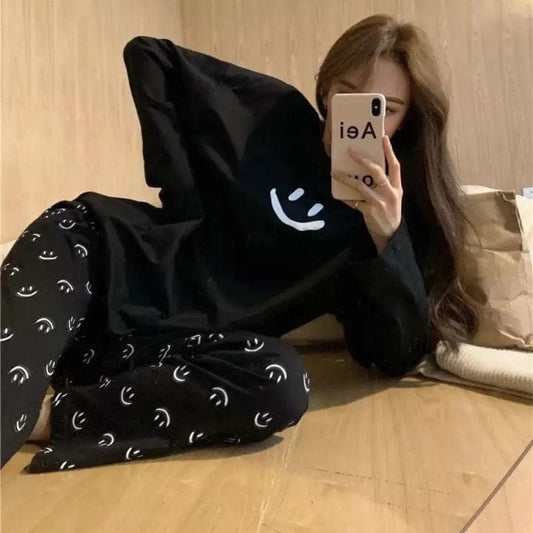 Black smile print full sleeves cotton night suit by Comfettie, featuring a comfortable design with colorful printed patterns.
