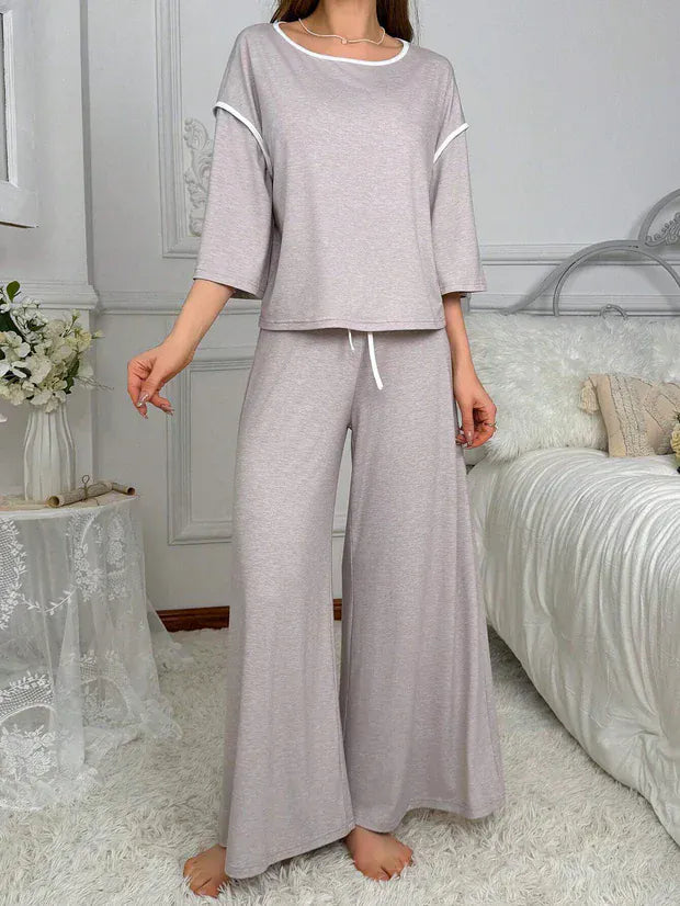 Grey palazzo style night suit by Comfettie, featuring comfortable, flowing fabric and relaxed fit for cozy sleepwear.