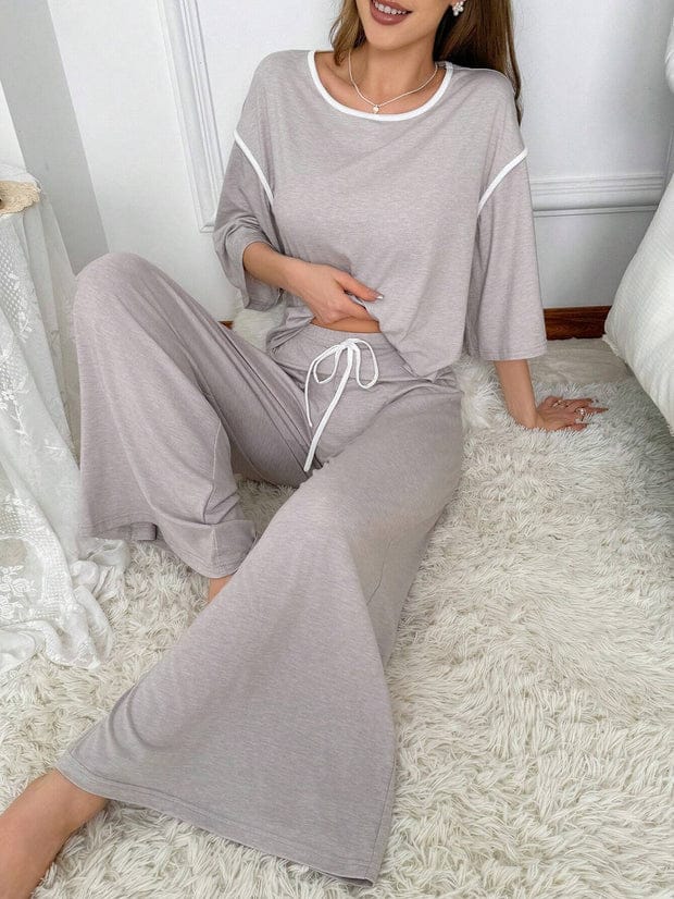 Grey palazzo style night suit by Comfettie, featuring loose-fitting, comfortable fabric perfect for relaxed sleepwear.