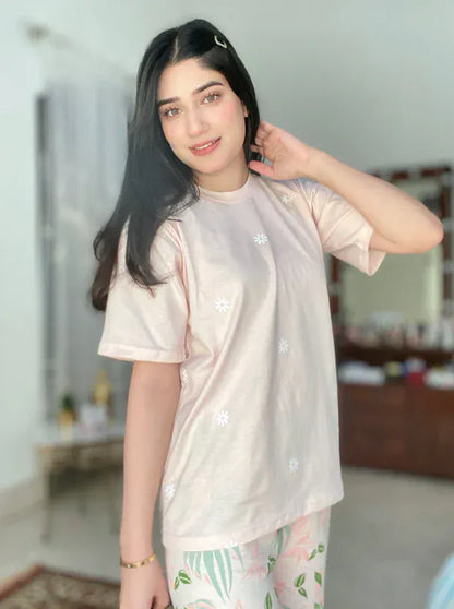 Comfortable peach printed pajama night suit by Comfettie, featuring soft fabric and a relaxed fit for cozy sleepwear.