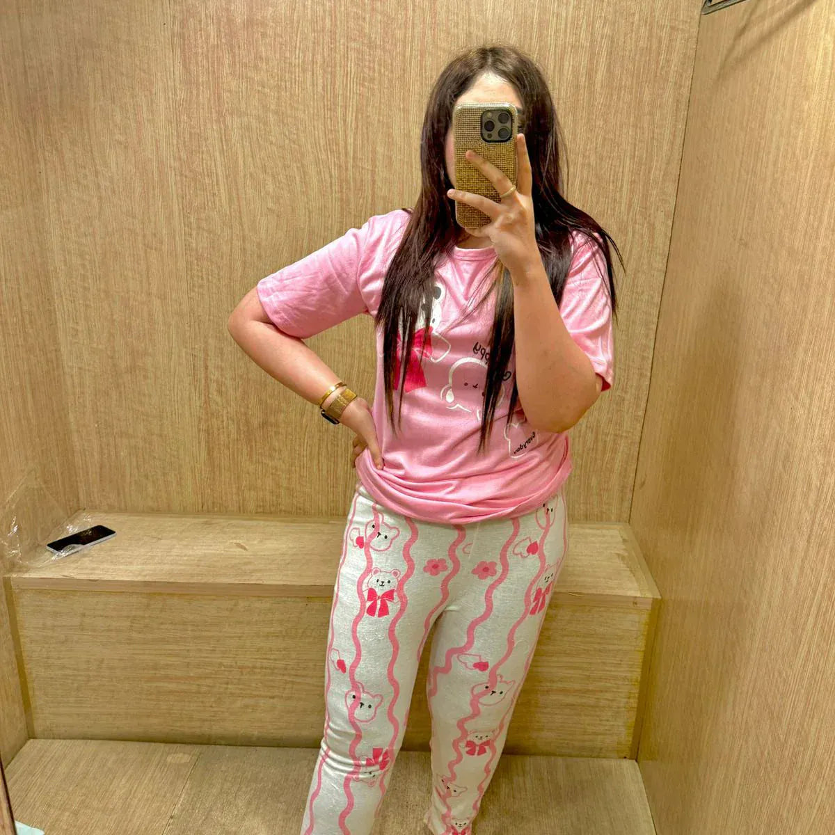 Pink happy bear design night suit by Comfettie, made of premium fabric for girls and women, featuring a cozy, playful look.