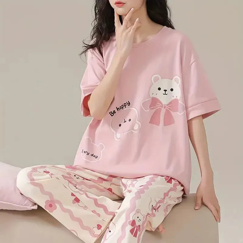 Pink happy bear design night suit by Comfettie made of premium fabric for girls and women, featuring a cozy, playful look.