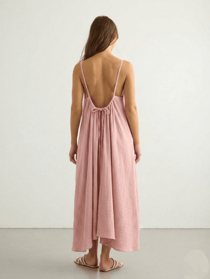 Nextry.pk backless maxi dress featuring a flowing fabric and elegant design, perfect for formal or summer occasions.
