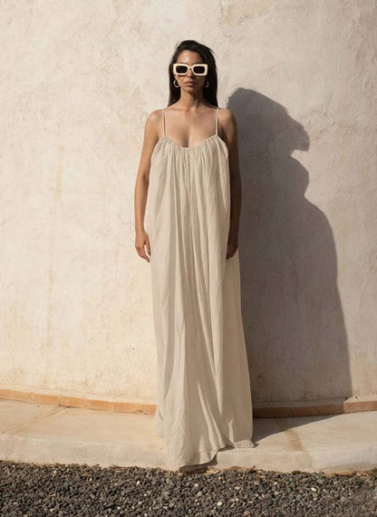 Nextry.pk backless maxi dress featuring a flowing silhouette and elegant design, perfect for formal or summer occasions.