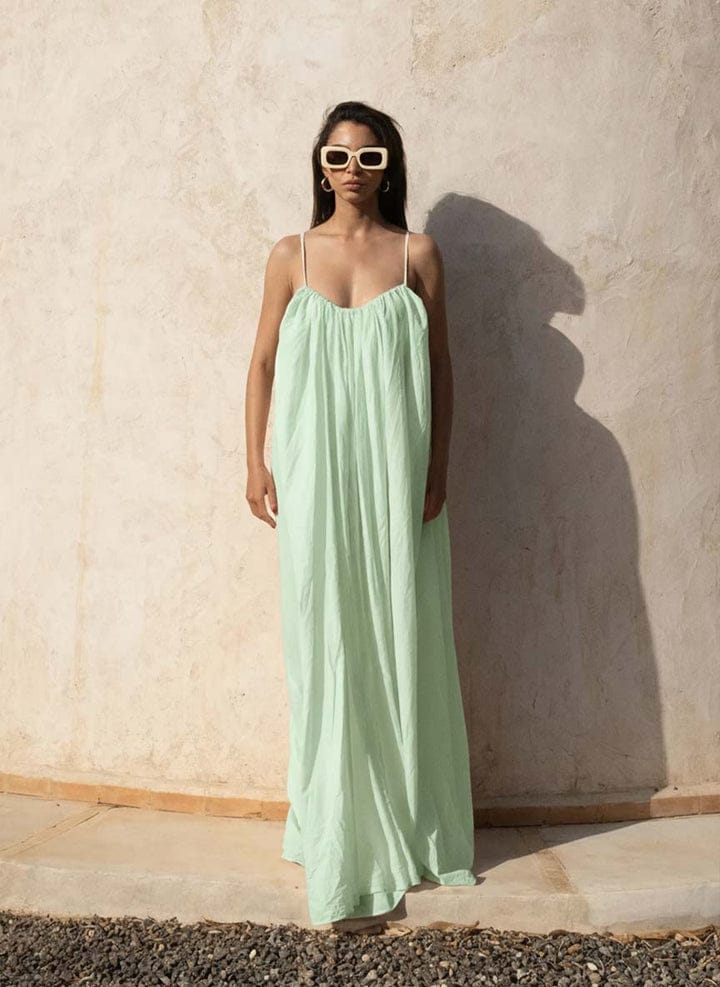 Nextry.pk backless maxi dress featuring a flowing silhouette and elegant design, perfect for formal or summer occasions.
