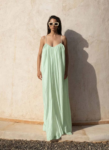 Nextry.pk backless maxi dress featuring a flowing silhouette and elegant design, perfect for formal or summer occasions.