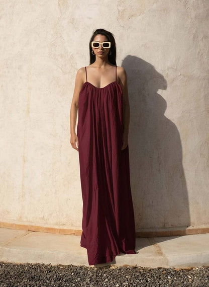 Nextry.pk backless maxi dress featuring a flowing silhouette and elegant design, ideal for formal occasions.