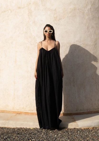 Nextry.pk backless maxi dress with flowing fabric and elegant design, perfect for formal or evening occasions.