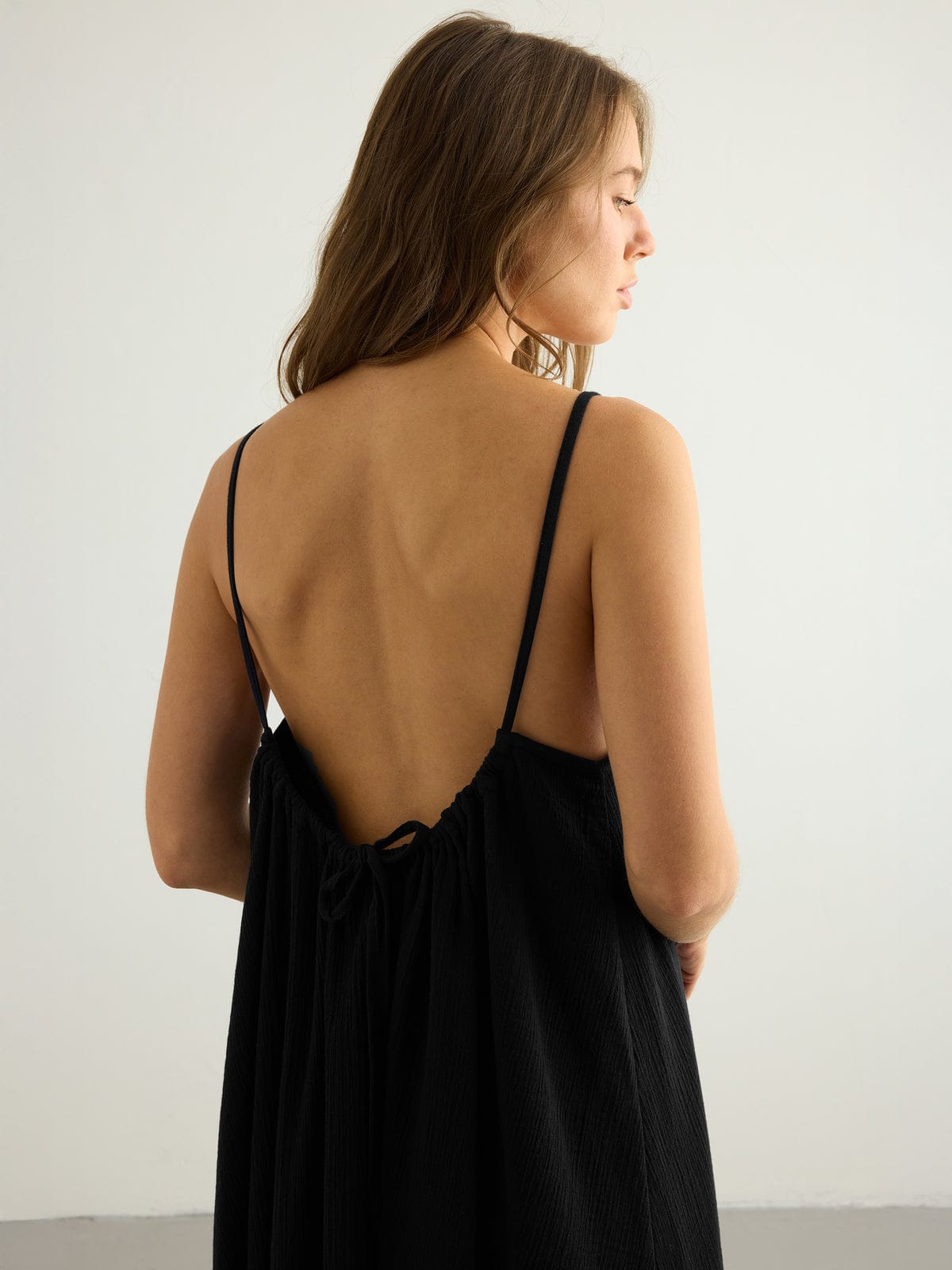 Nextry.pk backless maxi dress featuring flowing fabric and elegant design, perfect for formal or summer occasions.