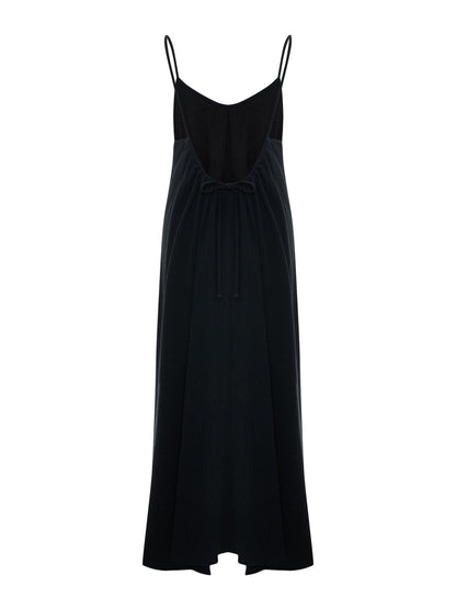 Black Back Less Maxi Dress by Nextry.pk, featuring a stylish open-back design and flowy silhouette for elegant summer wear.