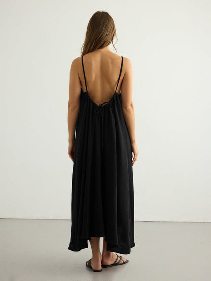 Black Back Less Maxi Dress by Nextry.pk featuring a flowing silhouette and elegant backless design.