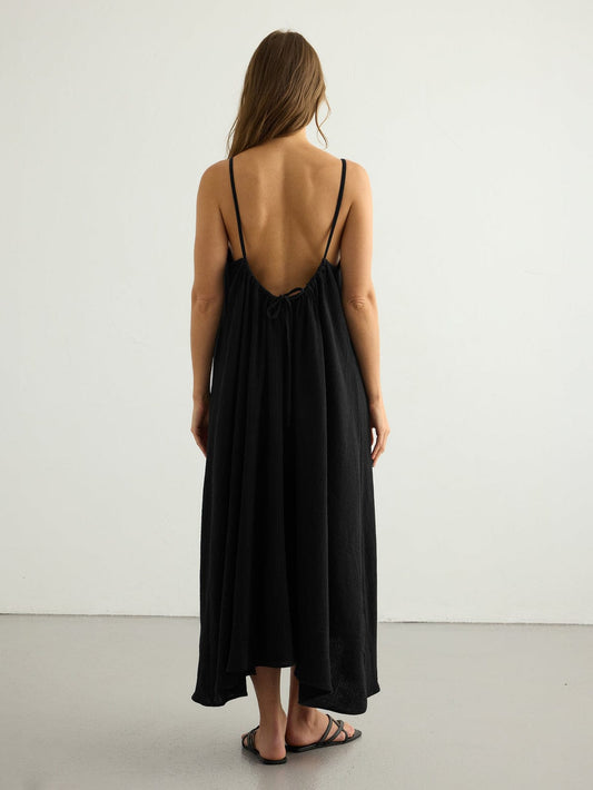 Black Back Less Maxi Dress by Nextry.pk featuring a flowing silhouette and elegant backless design.
