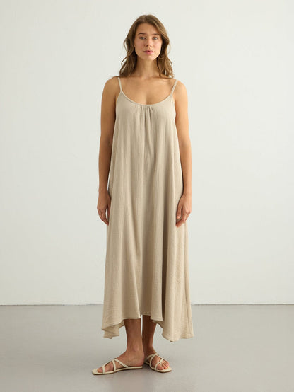 Oatmeal Back Less Maxi Dress by Nextry.pk, flowing fabric with open back design, perfect for summer or casual occasions.