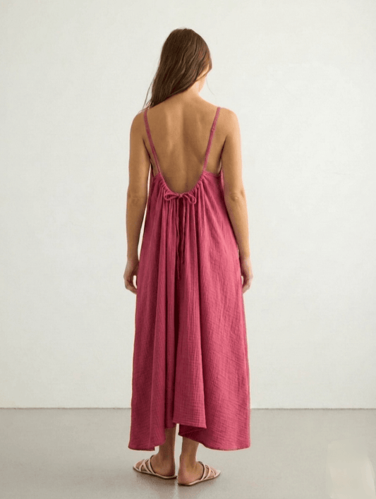Nextry.pk backless maxi dress featuring a flowing silhouette and elegant design, perfect for formal or summer occasions.