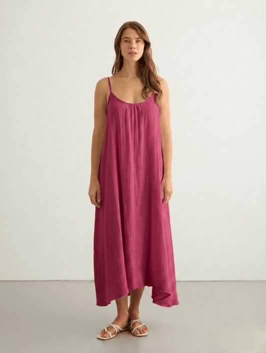 Pink Back Less Maxi Dress by Nextry.pk featuring a flowy fabric and open back design, perfect for elegant summer occasions.