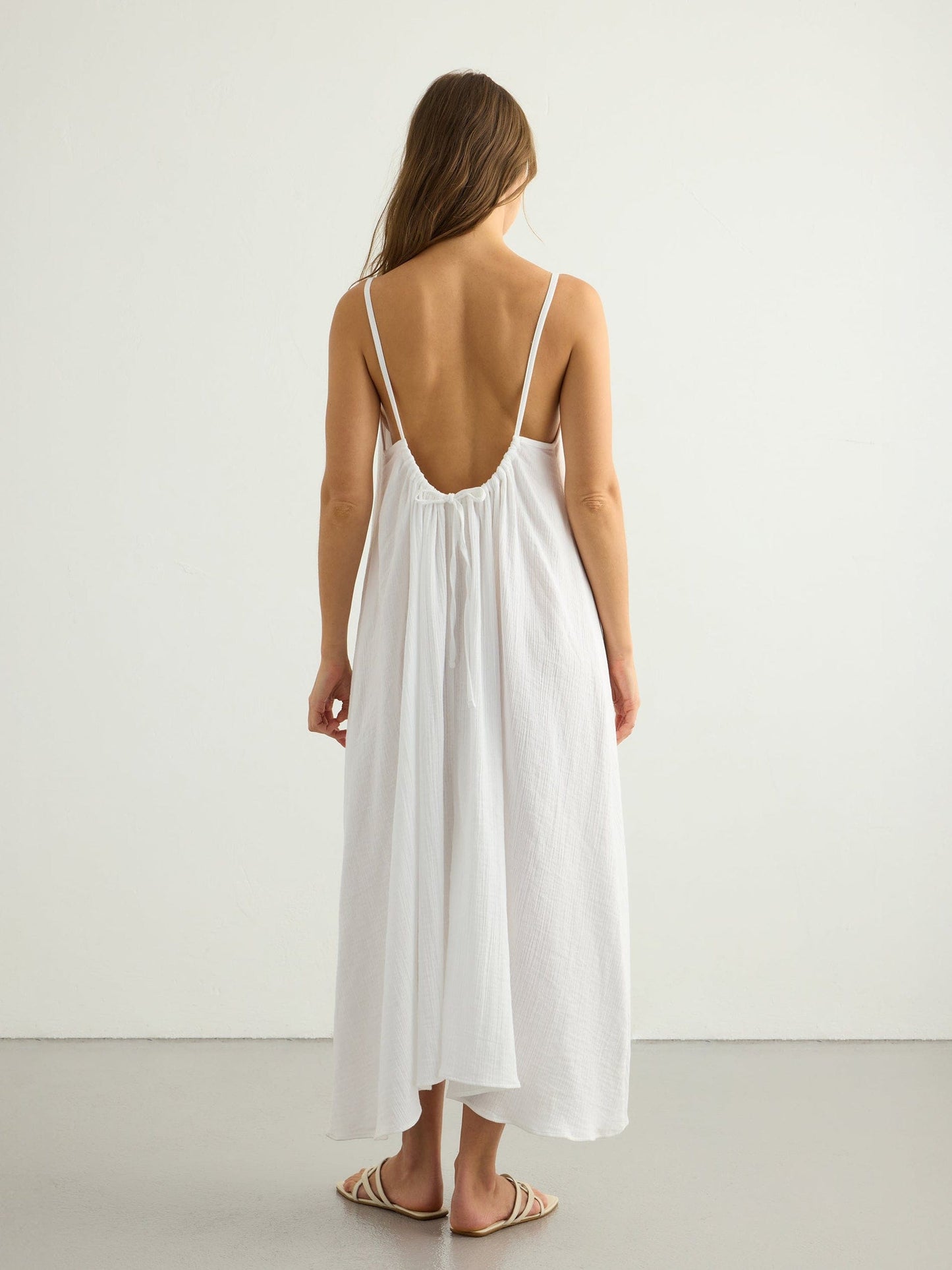 Nextry.pk backless maxi dress in flowing fabric, featuring a stylish design perfect for elegant summer occasions