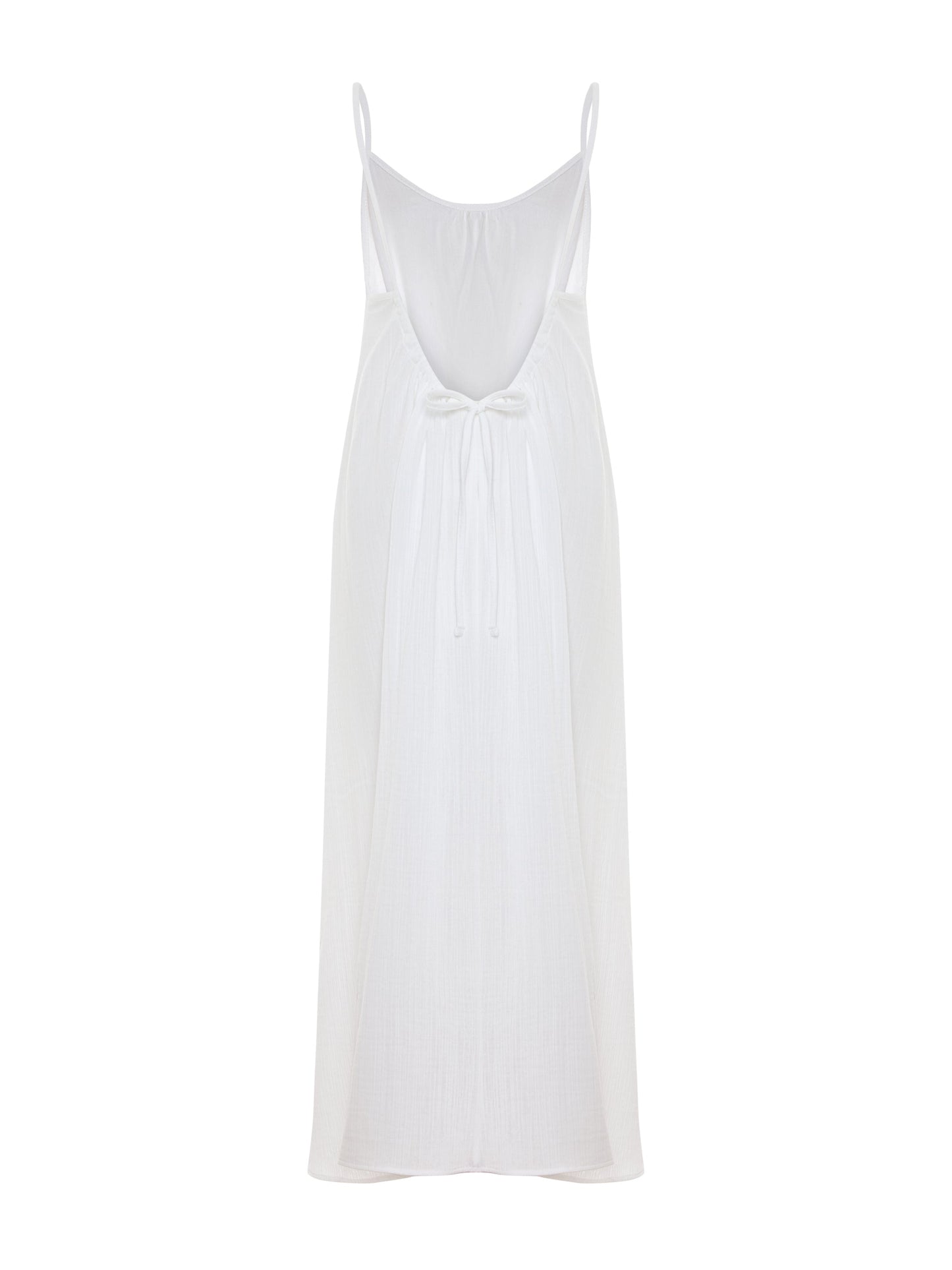 White Back Less Maxi Dress by Nextry.pk featuring a flowing design and open back for elegant summer wear.