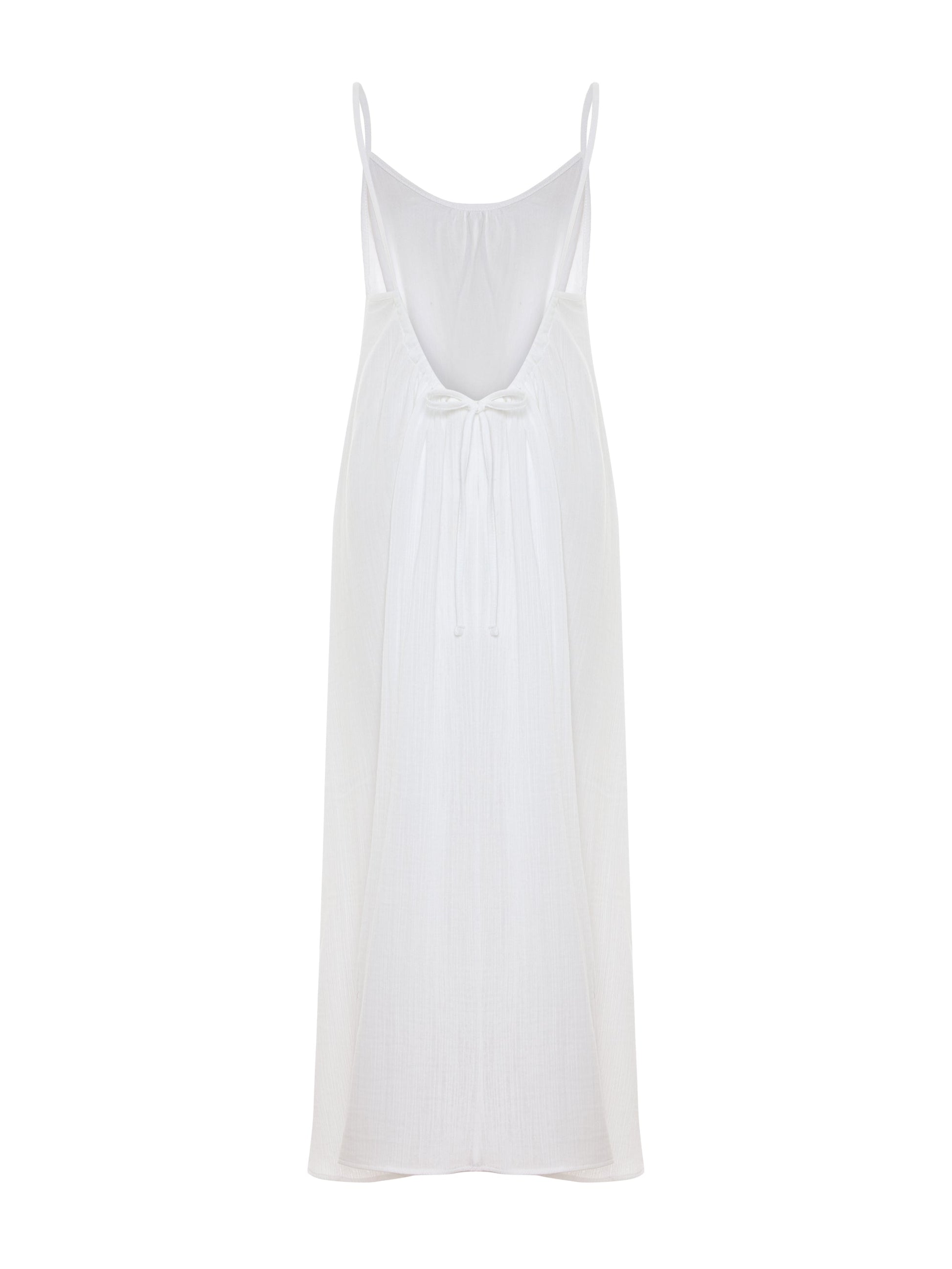 White Back Less Maxi Dress by Nextry.pk featuring a flowing design and open back for elegant summer wear.