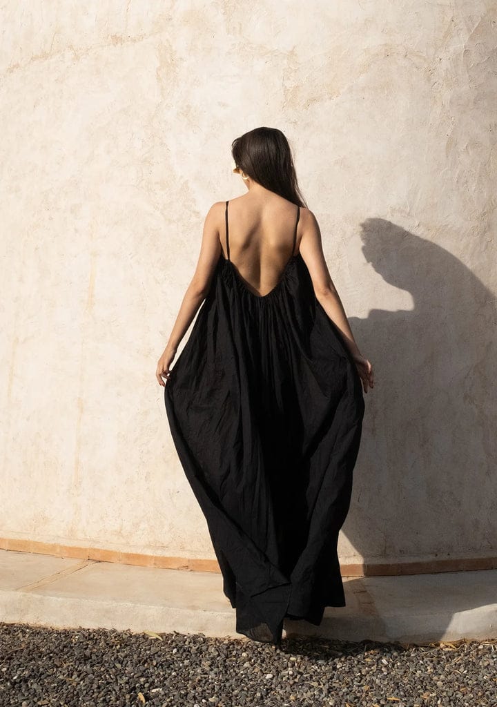 Nextry.pk backless maxi dress in flowing fabric with a relaxed fit, perfect for elegant summer or evening wear.