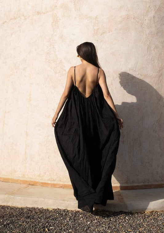 Nextry.pk backless maxi dress in flowing fabric with a relaxed fit, perfect for elegant summer or evening wear.