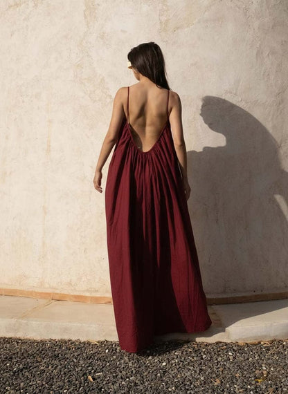 Nextry.pk backless maxi dress featuring a flowing silhouette and elegant design, perfect for formal or summer occasions.