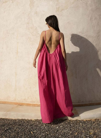 Nextry.pk backless maxi dress in flowing fabric with a deep V-back, elegant and perfect for formal or summer occasions.