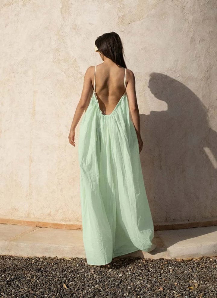 Nextry.pk backless maxi dress featuring a flowing silhouette and elegant design, perfect for stylish evening wear.
