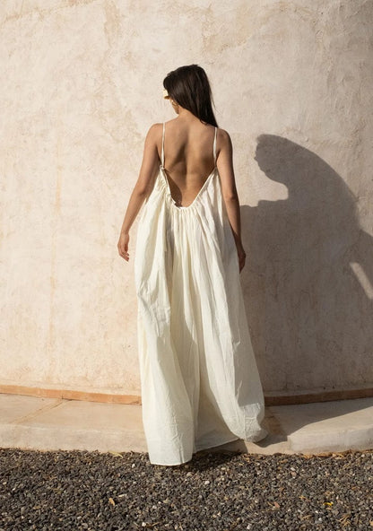 Nextry.pk backless maxi dress in flowing fabric, featuring a stylish open back and elegant design for formal or casual wear