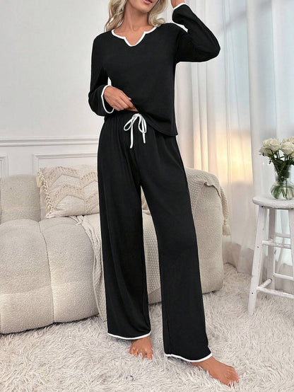 Black palazzo style night suit for women made of cotton jersey, featuring a comfortable, relaxed fit from The Style Bazar.