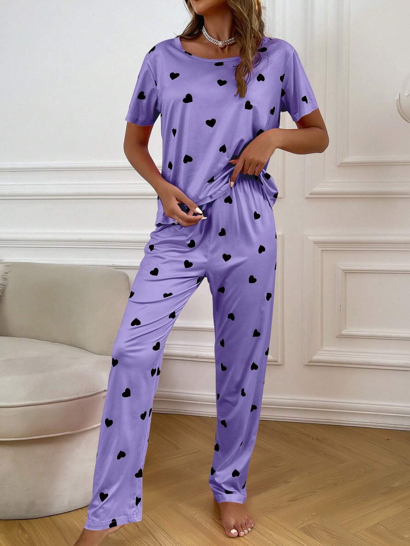 Purple and black multi-heart printed women’s cotton jersey night suit by The Style Bazar, featuring a comfortable, relaxed fit.