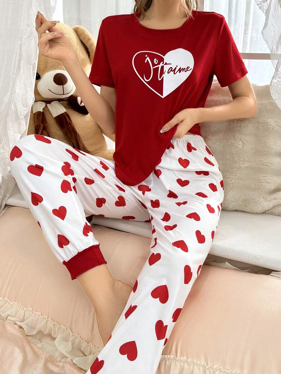 Red heart printed women’s cotton jersey night suit with long sleeves and relaxed fit, ideal for comfortable sleepwear.