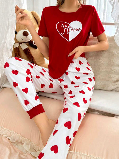 Red heart printed women’s cotton jersey night suit with long sleeves and relaxed fit, ideal for comfortable sleepwear.