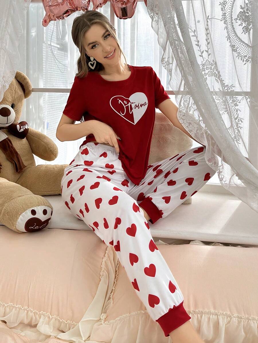 Red heart printed women's night suit made of cotton jersey, stylish and comfortable extended sleepwear from The Style Bazar.