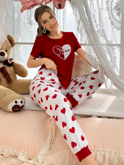 Red heart printed women's night suit made of cotton jersey, stylish and comfortable extended sleepwear from The Style Bazar.