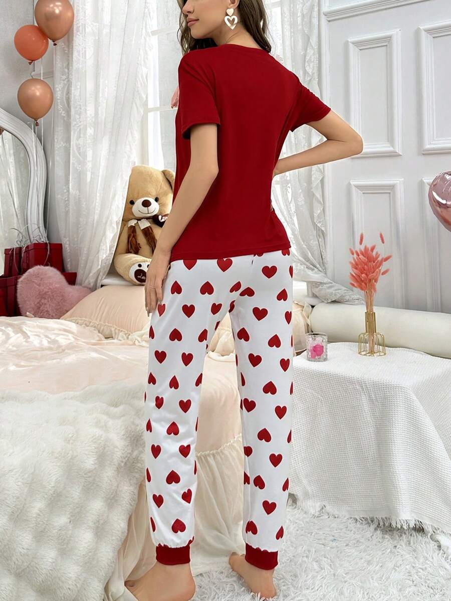 Red heart printed women's cotton jersey night suit with long sleeves and relaxed fit by The Style Bazar.