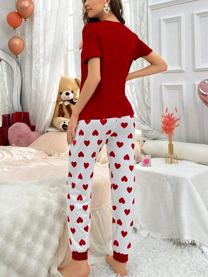 Red heart printed women's cotton jersey night suit with long sleeves and relaxed fit by The Style Bazar.