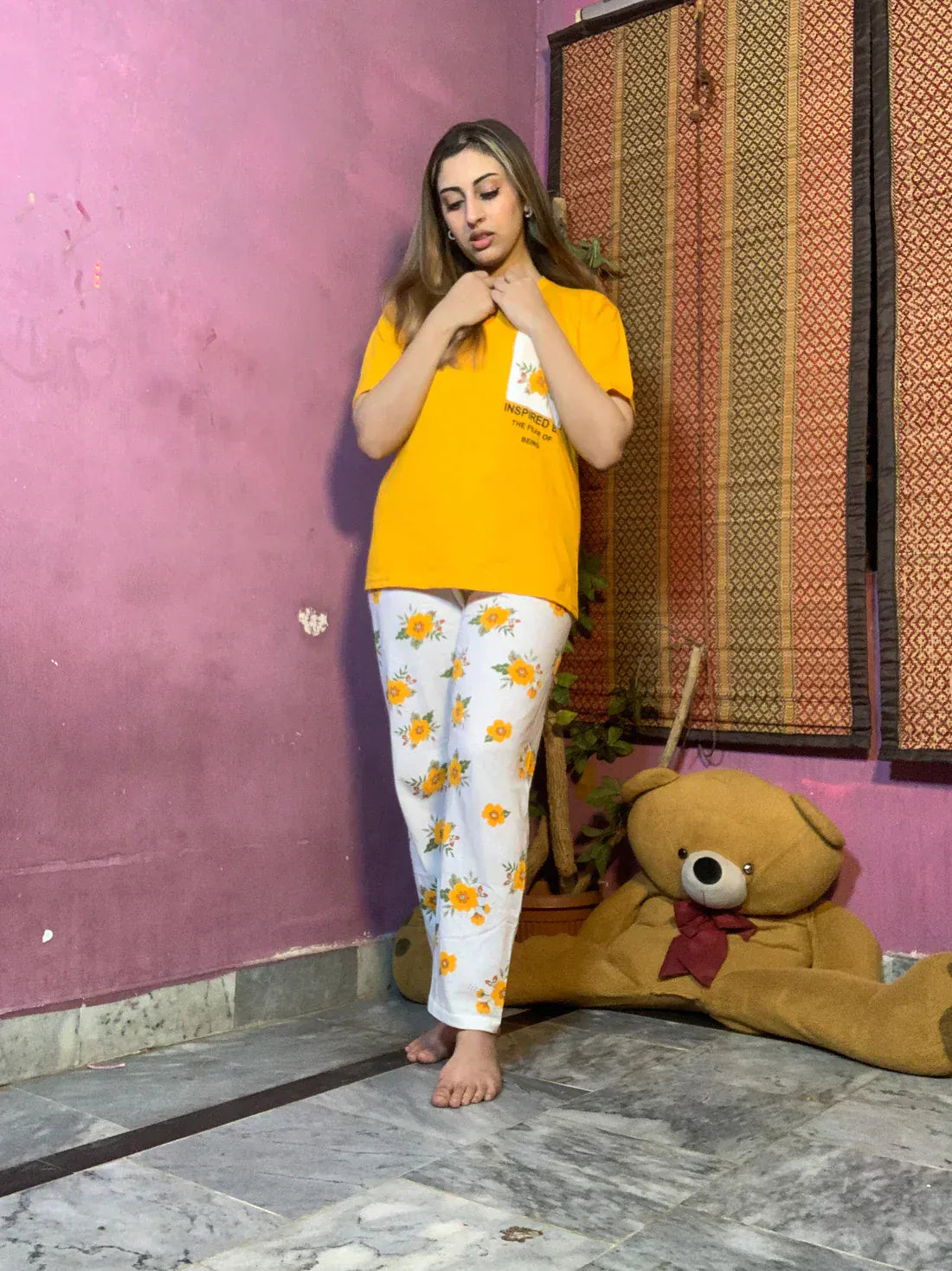 Yellow pocket printed women's night suit made of cotton jersey, featuring a comfortable extended design by The Style Bazar.