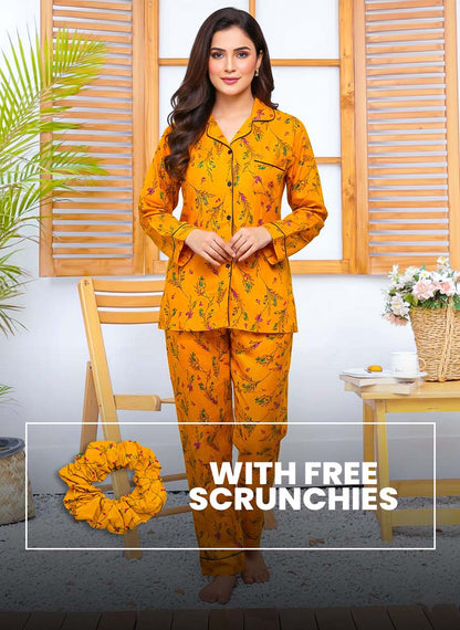 Linen PJ set with warm glow print from The Style Bazar, paired with colorful scrunchies placed on a neutral background.