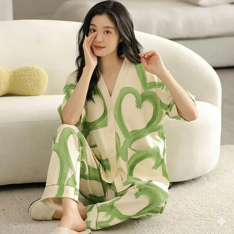 Green hearts printed V-neck cotton jersey night suit with button details from The Style Bazar, perfect for comfortable sleepwear.