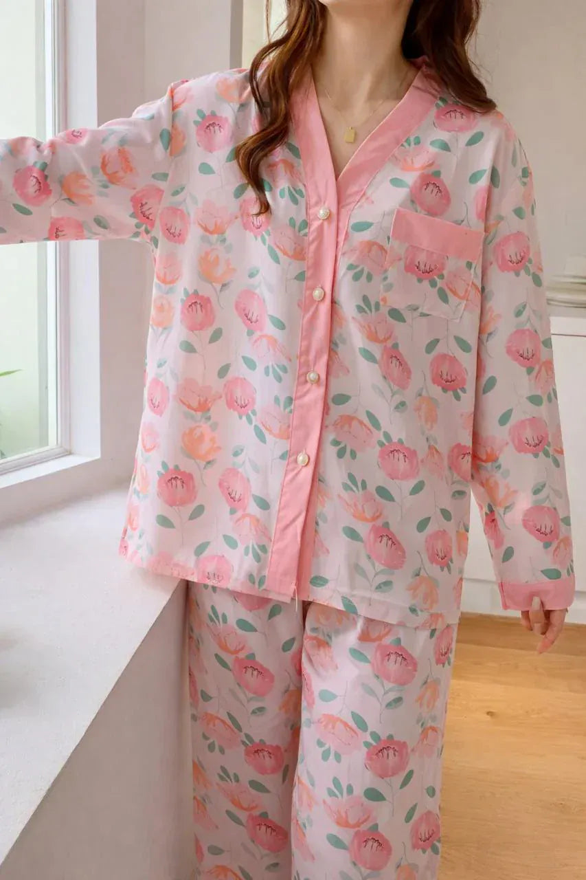 Pink rose printed V-neck cotton jersey night suit with button details, styled for comfort and relaxation.