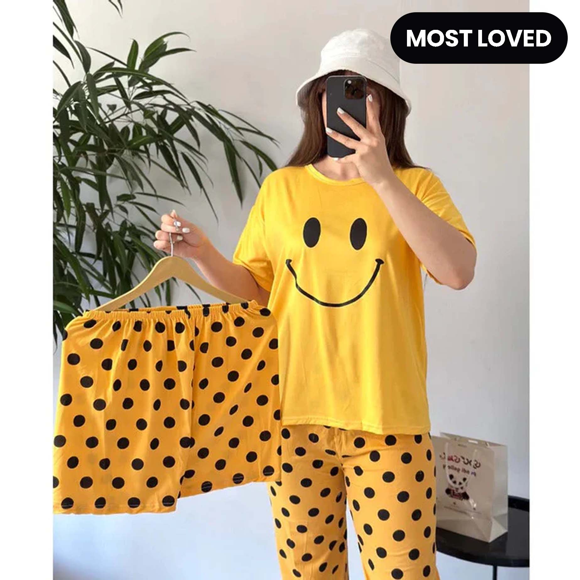 Women’s yellow smiley face 3-piece nightwear set by The Style Bazar, includes comfortable top, pants, and shorts for cozy sleepwear.