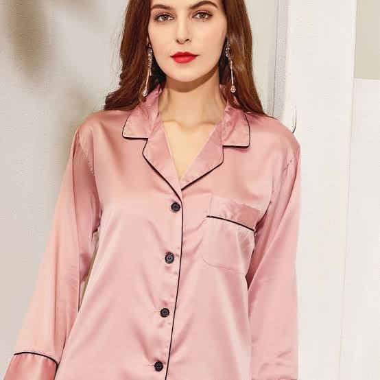Three Queen viscose silk trouser shirt displayed on a hanger, featuring a relaxed fit and elegant design.